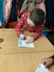 Child creating a leaf rubbing