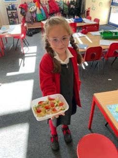 Child with a healthy pasta dish