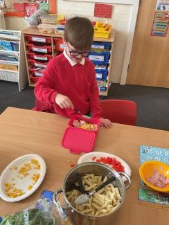 Child with a healthy pasta dish