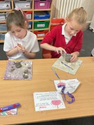 Child creating a Anglo-Saxon statue