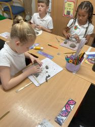 Child creating a Anglo-Saxon statue