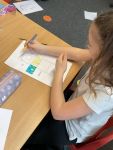 Child making a chocolate box