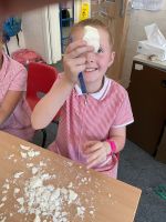 Child making tools out of soap