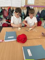Child making tools out of soap