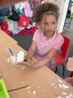 Child making tools out of soap